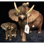 Large Beswick china trumpeting African elephant, together with another similar smaller version,