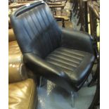 Black leather finish retro armchair on a metal base. (B.P. 24% incl.