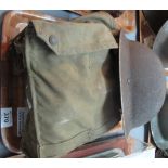 World War Two tommy helmet, together with gas mask in canvas bag. (B.P. 24% incl.