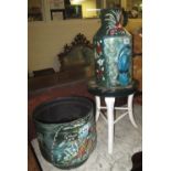 Three metal canal bargeware type items to include; stool, jardiniere and a flagon,