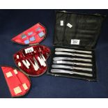 Cased set of silver handled butter knives, together with a cased manicure set. (2) (B.P. 24% incl.