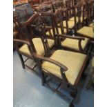 Set of eight Chippendale style mahogany dining chairs with drop in seats on cabriole legs and