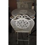 Pierced metal circular garden table and two matching chairs. (B.P. 24% incl.