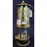 Protector lamp and lighting Company Ltd brass miner's safety lamp (unused). (B.P. 24% incl.