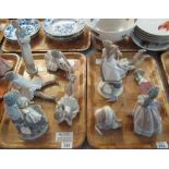 Two trays of Lladro, Nao and other Spanish porcelain figurines to include; ballerinas,