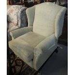 Victorian style upholstered wing armchair with extending footrest. (B.P. 24% incl.