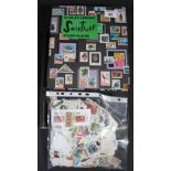 All world stamps collection in two albums with a plastic bag of on & off paper. (B.P. 24% incl.