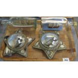 Two ships in bottles together with a pair of Sailor's Valentines, starfish shaped,