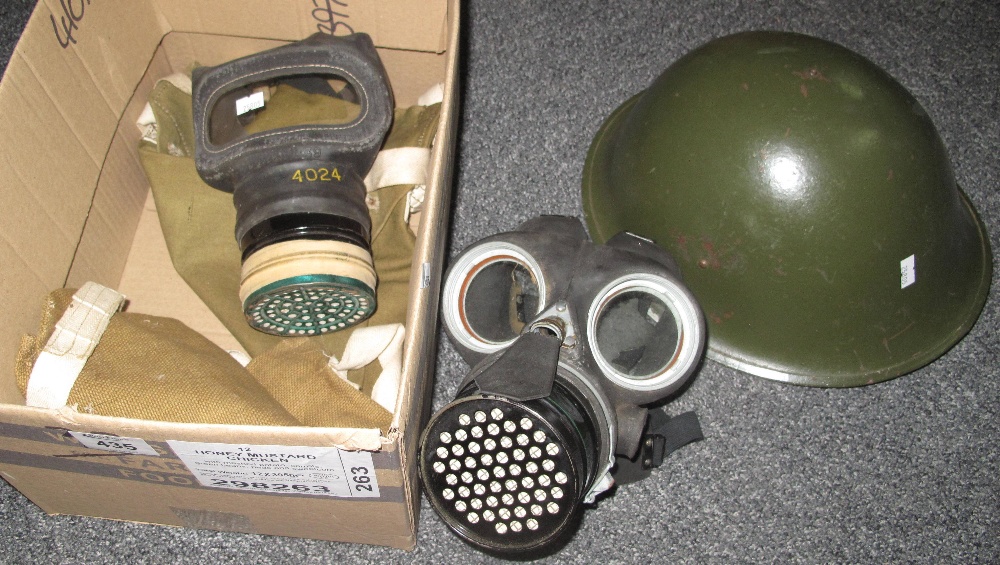 British military post war helmet together with two gas masks and canvas bags. (B.P. 24% incl.