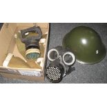 British military post war helmet together with two gas masks and canvas bags. (B.P. 24% incl.