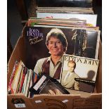 Box of assorted vinyl LPs and rpm 45s to include: John Denver,