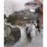 Two composite garden bird baths, one with figural pedestal (2). (B.P. 24% incl.