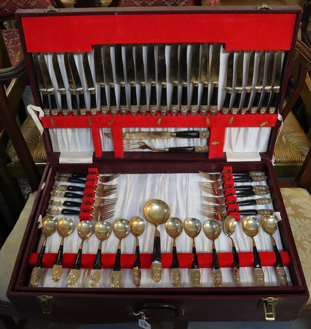 Suitcase of plated Thai gilded cutlery. (B.P. 24% incl.