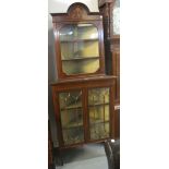 Edwardian mahogany inlaid two stage glazed corner display cabinet on square tapering legs. (B.P.