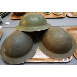 Three World War II British army helmets. (3) (B.P. 24% incl.