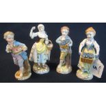 Set of four similar German porcelain juvenile street vendors, two boys, two girls.
