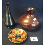 Moorcroft art pottery saucer with pomegranate decoration on blue ground,