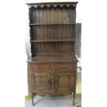 20th century oak two stage, rack back dresser of narrow form. (B.P. 24% incl.