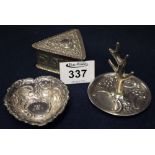 Three small items of silver to include; ring stand, pin dish and triangular box and cover. (B.P.