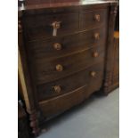 Victorian mahogany bow front chest of two short and three long drawers on baluster turned supports.