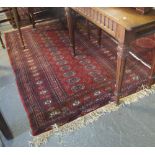 Red ground Bokhara style rug. (B.P. 24% incl.