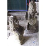 Pair of composite garden standing lions with amorials, on square stepped bases (2). (B.P. 24% incl.