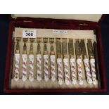 Cased set of porcelain handled dessert knives and forks. (B.P. 24% incl.