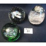 Caithness art glass paperweight, together with two other coloured glass paperweights. (3) (B.P.