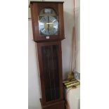 Reproduction mahogany cased longcase clock with brass and silvered dial, three weights and pendulum.