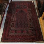 Red ground Middle Eastern geometric unidirectional prayer rug. (B.P. 24% incl.