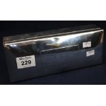 Large rectangular silver cigarette box with wooden lined interior and engraved initials,
