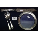 Silver handled cake knife and a silver photograph frame, silver spoon and fork. (B.P. 24% incl.