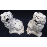 Two similar Beswick pottery seated fireside spaniels. (2) (B.P. 24% incl.