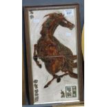 Two Chinese glazed pottery tiles depicting a rearing horse in a single frame, 40 x 20cm approx.