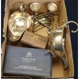 Group of assorted silver plated items to include; sauce boats, napkin rings, dwarf candlesticks,