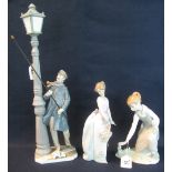 Three Spanish porcelain figures to include; Lladro lamp lighter,