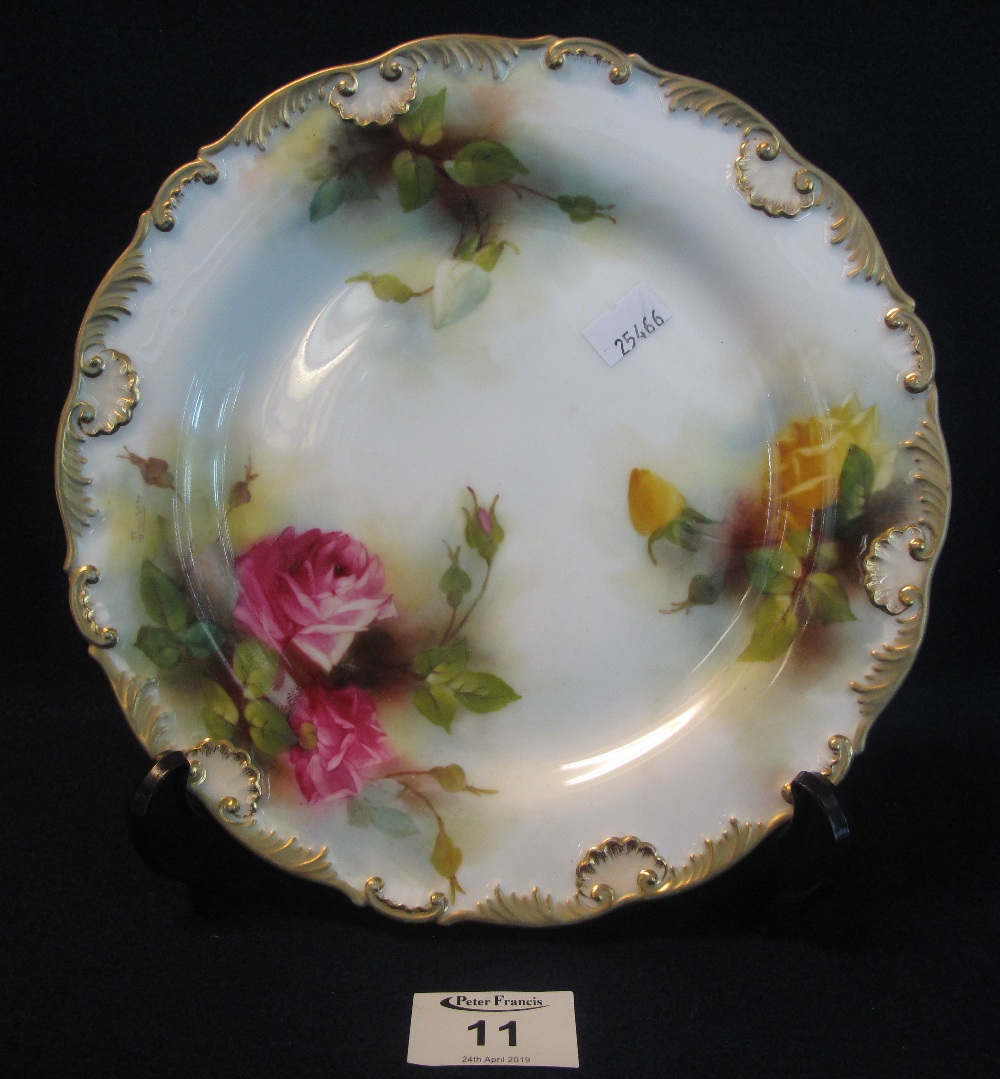 Royal Worcester porcelain cabinet plate painted with roses on a white ground with gilded shell