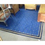 Modern rug on a blue ground with ecclesiastical design. (B.P. 24% incl.