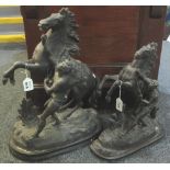 Two similar early 20th Century spelter Marley horse figure groups on naturalistic oval bases.