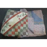 Two vintage patchwork floral design quilts,