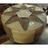 Modern circular leather and fabric stitched pouffe. (B.P. 24% incl.