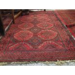 Middle Eastern geometric design rug with latch hook lozenges. (B.P. 24% incl.