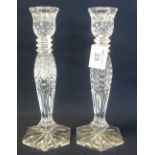 Pair of Waterford crystal glass baluster shaped candlesticks with hobnail and star cut decoration,