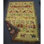 Fringed woollen tapestry wall hanging with figural, foliate, animal and building decoration. (B.P.
