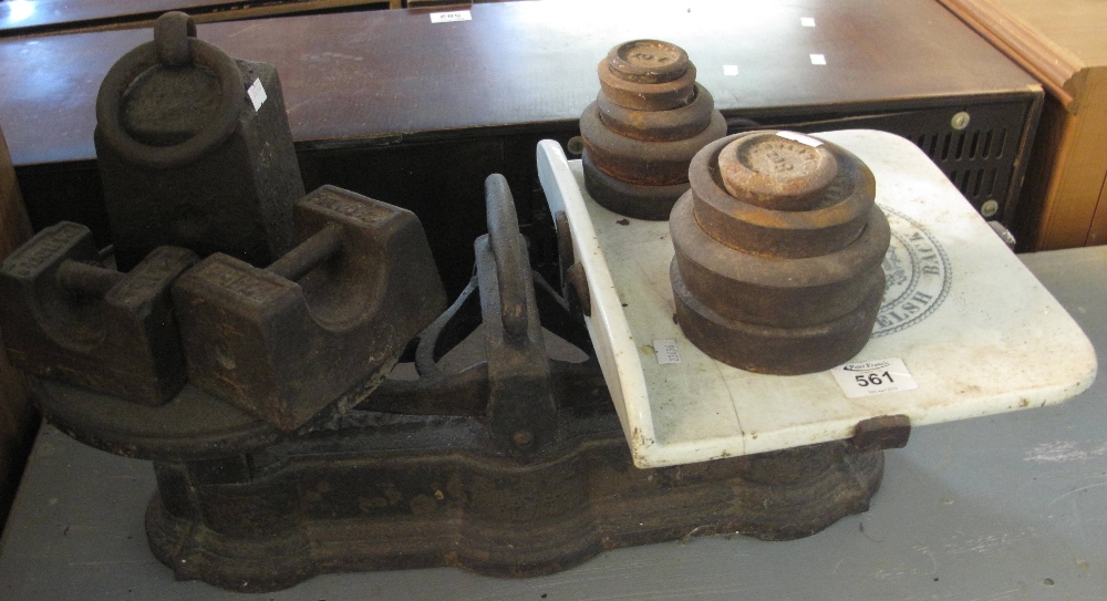 Cast iron shop scales marked Bartlett & Son Welsh back Bristol with cast iron weights. (B.P.