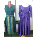 A vintage green silk belted sleeveless dress with gold striped decoration on the skirt (70's and