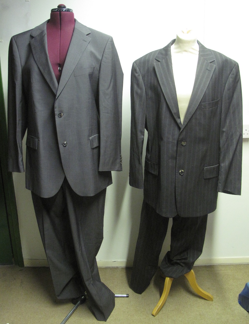 Six designer fine wool men's suits to include; a grey striped suit by Hugo Boss,