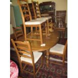 Ercol elm extending oval dining table on X stretcher support,