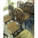 Set of four early 20th century stained elm and ash wheel and spindle back farmhouse kitchen chairs.