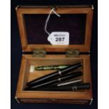 Middle Eastern carved sandalwood jewellery casket together with five assorted fountain pens